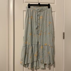 Hi-low light blue flower pattern peasant skirt with ruffle.